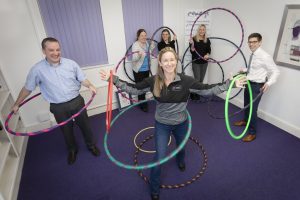 Coxeys staff Hula Hoop with Sasha Kenney from Hoola nation. Pictured are Coxeys staff Anthony Lewis Director, Helen McAllster, Kirsty Roberts, Tracy Perkins and Gruff Hughes with Sasha Kenney.